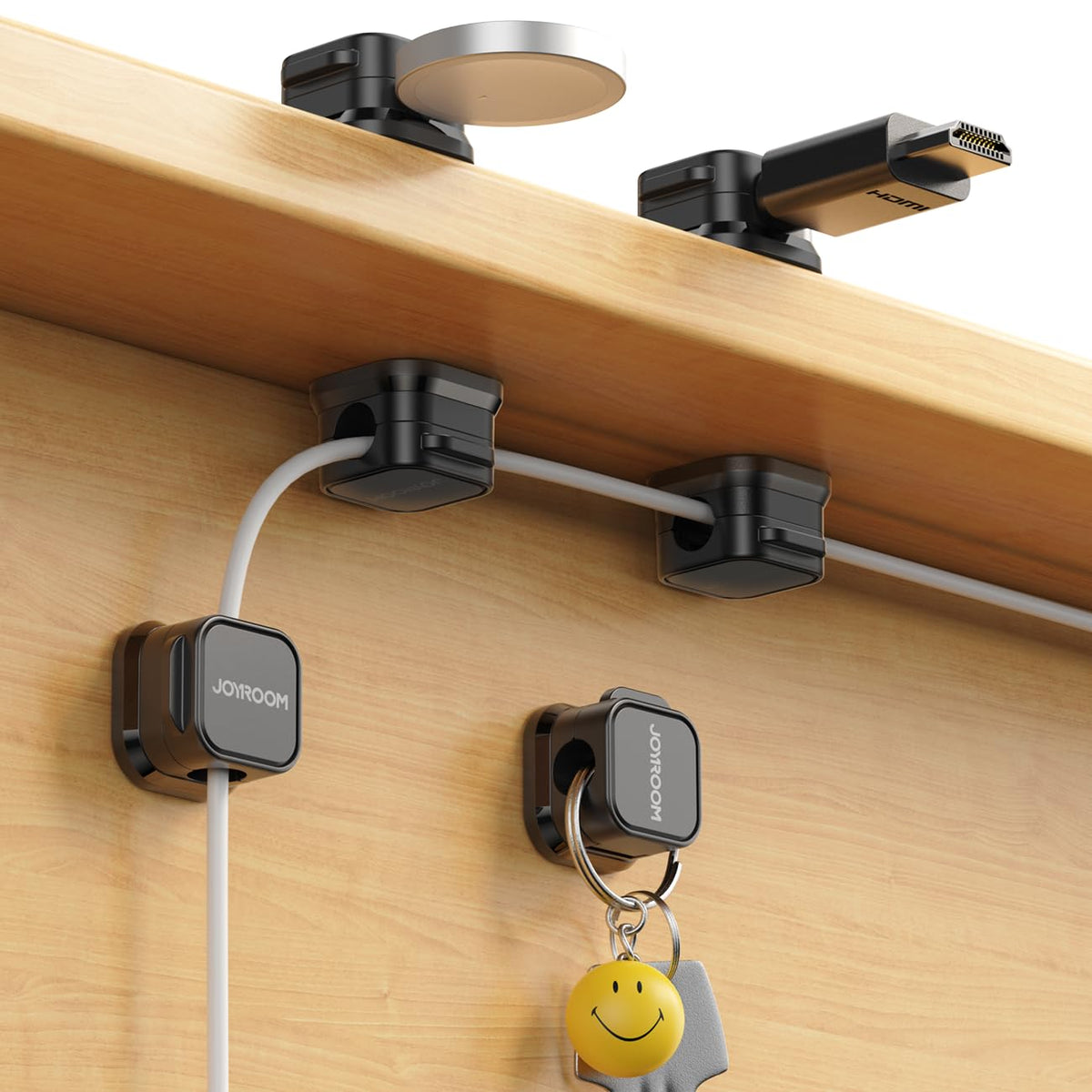 Magnetic cable clip holding charging cord