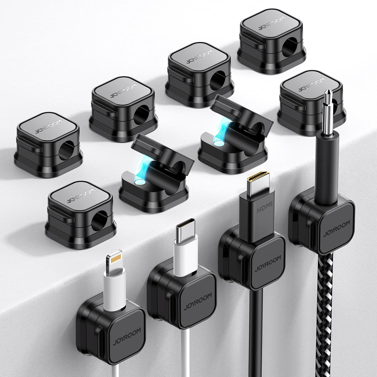 Adhesive cable clips on desk edge